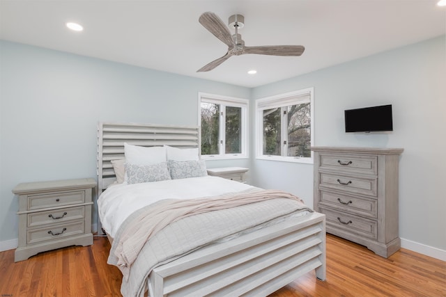 bedroom with ceiling fan and light wood-type flooring