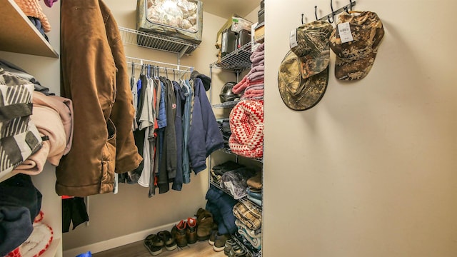 spacious closet featuring hardwood / wood-style floors