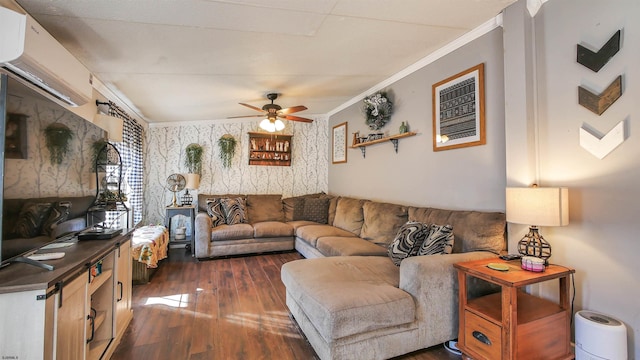 living room with ceiling fan, ornamental molding, and dark wood-type flooring