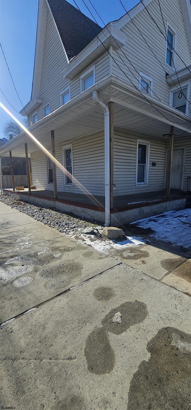 view of property exterior with a porch