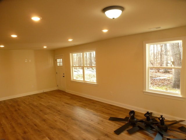 spare room with hardwood / wood-style floors