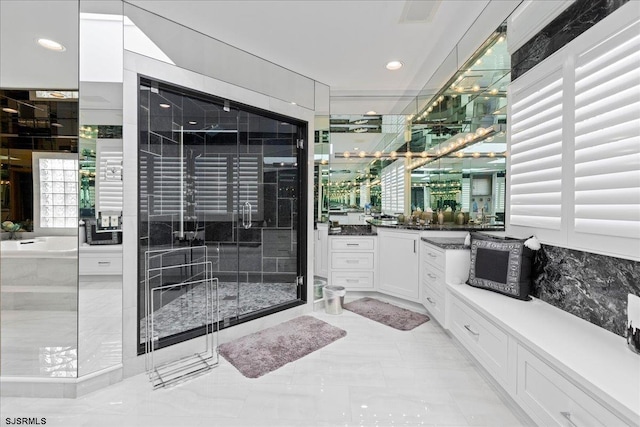 full bathroom featuring a shower stall and vanity