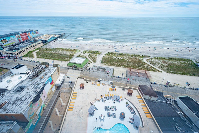 bird's eye view featuring a water view and a view of the beach