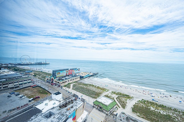 bird's eye view featuring a water view and a beach view