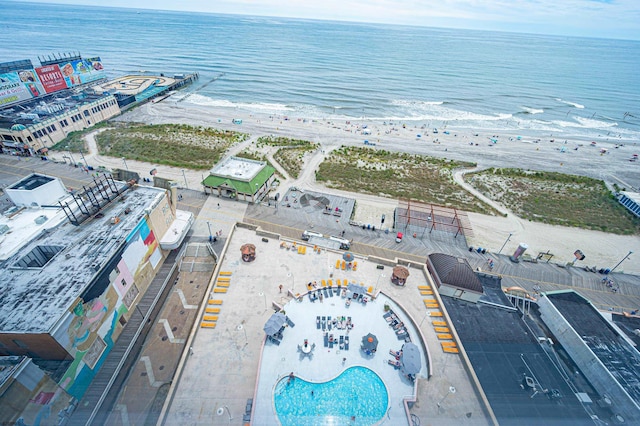 aerial view with a water view and a view of the beach