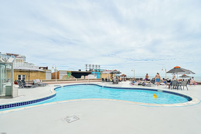 community pool with a patio area