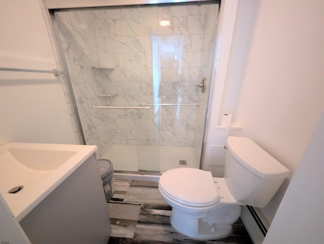 bathroom featuring a stall shower, vanity, and toilet