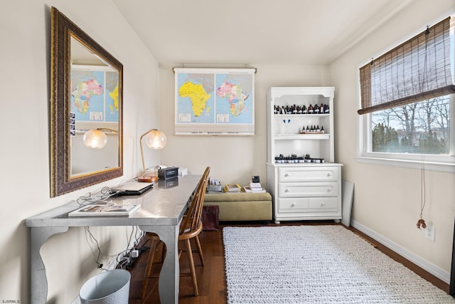 office with baseboards and dark wood-style flooring