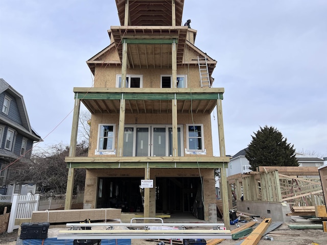 rear view of property featuring stucco siding