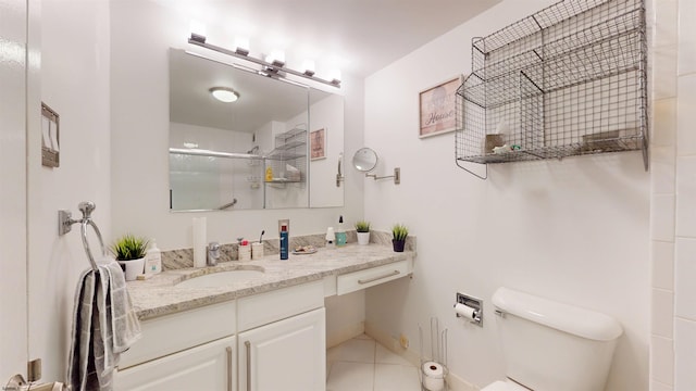 full bathroom featuring tile patterned flooring, a shower with door, vanity, and toilet