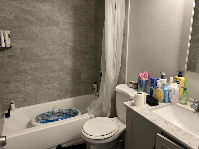 full bathroom with shower / bathtub combination with curtain, vanity, and toilet