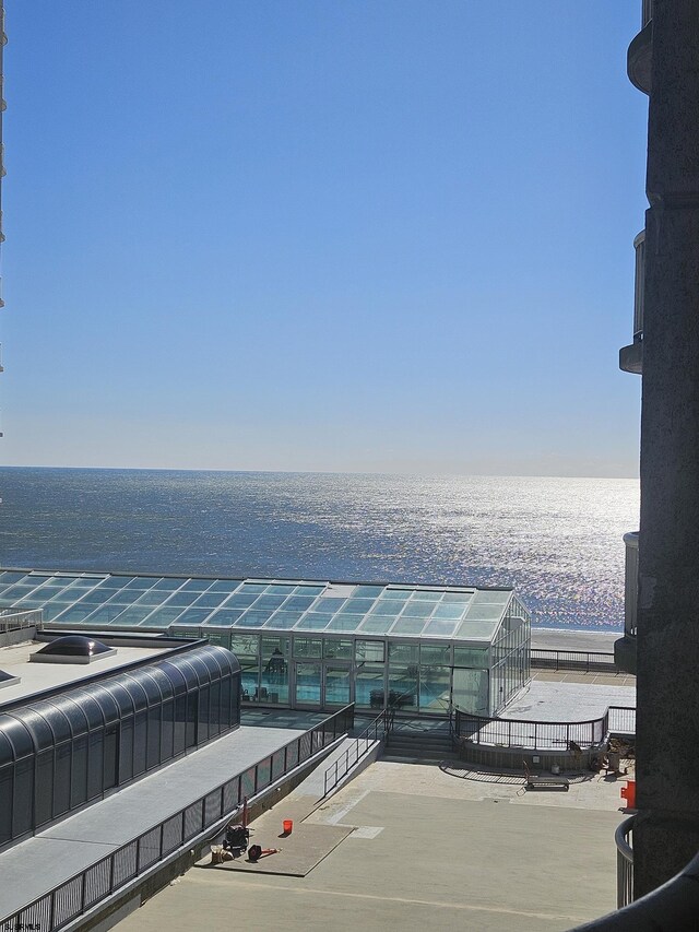 water view featuring an exterior structure and a view of the beach