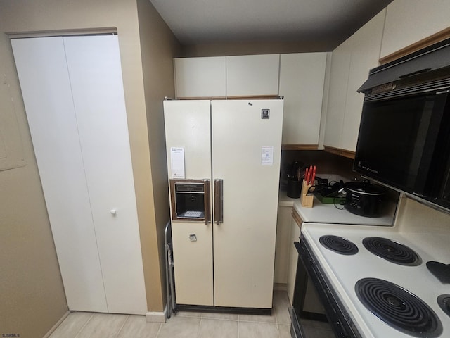 kitchen featuring white fridge with ice dispenser, light countertops, white cabinetry, and electric stove
