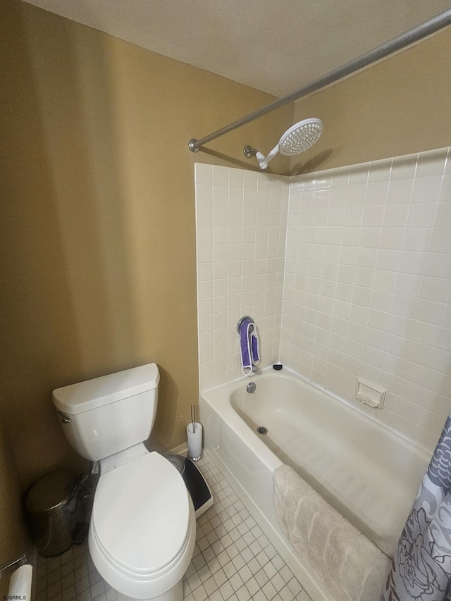 bathroom with a baseboard heating unit, shower / tub combo, toilet, and tile patterned floors