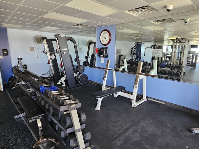 workout area with a drop ceiling and visible vents