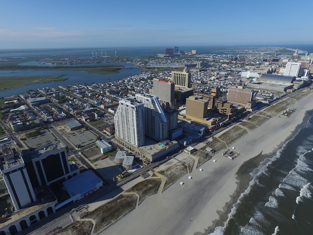 birds eye view of property with a view of city and a water view