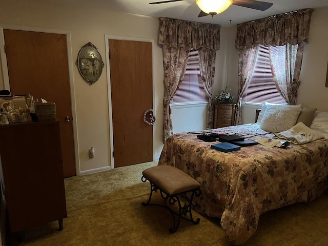 bedroom with a ceiling fan and carpet flooring