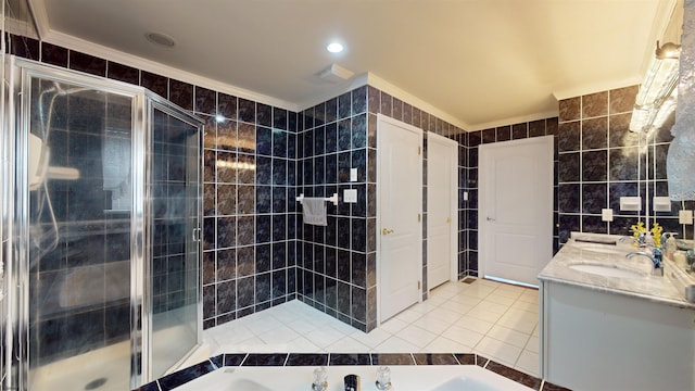 bathroom with a bath, tile walls, crown molding, and tile patterned floors