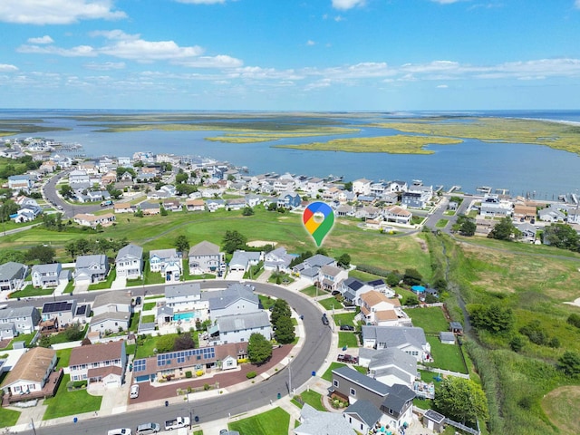 bird's eye view with a residential view and a water view