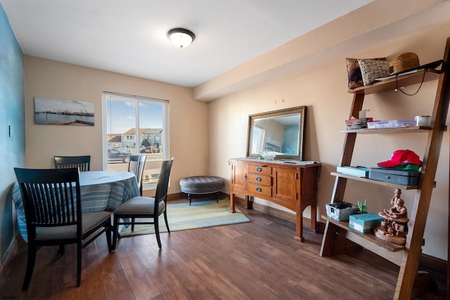 dining area with dark wood-style floors and baseboards