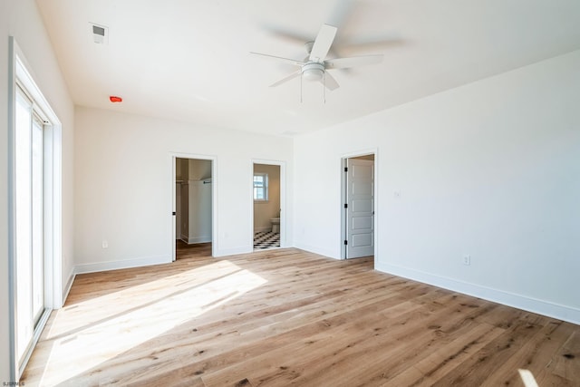 22 Roosevelt, Ocean City, NJ 08226 - unfurnished bedroom featuring light wood finished floors, baseboards, visible vents, ensuite bath, and a walk in closet