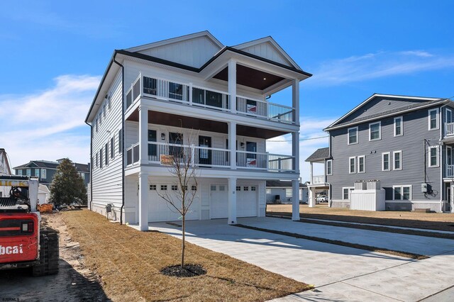 22 Roosevelt, Ocean City, NJ 08226 - view of front of property with driveway, a garage, and board and batten siding