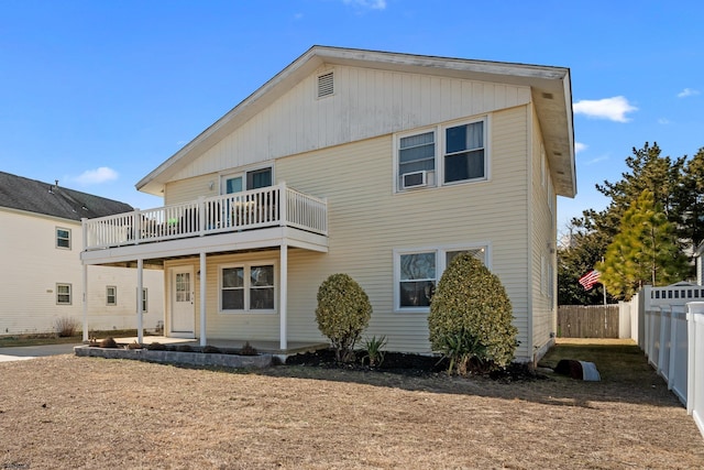 back of property with fence