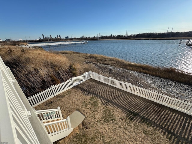 property view of water featuring fence