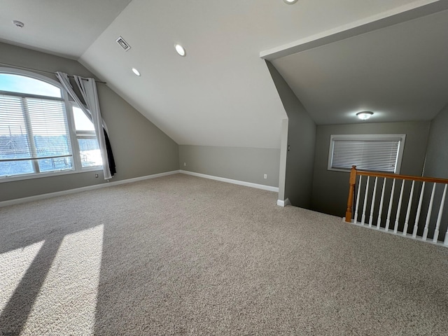 bonus room featuring lofted ceiling, recessed lighting, carpet floors, visible vents, and baseboards