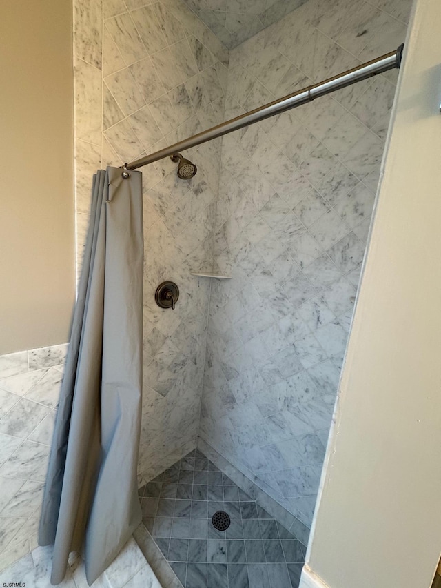 full bathroom featuring a shower stall