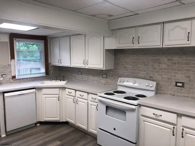 kitchen featuring a sink, white appliances, white cabinets, and light countertops