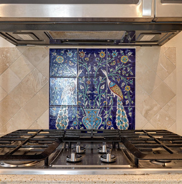 details with stovetop and decorative backsplash