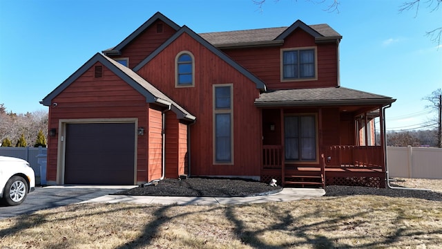 view of front of property with a porch, an attached garage, fence, and a shingled roof