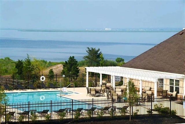 pool featuring fence and a patio