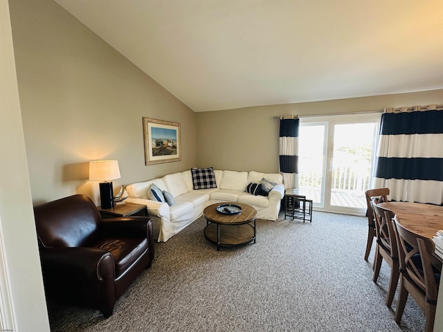 carpeted living room with vaulted ceiling