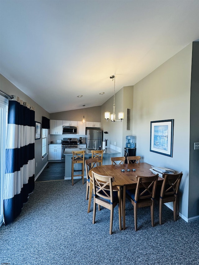 dining room featuring dark carpet, an inviting chandelier, baseboards, and vaulted ceiling