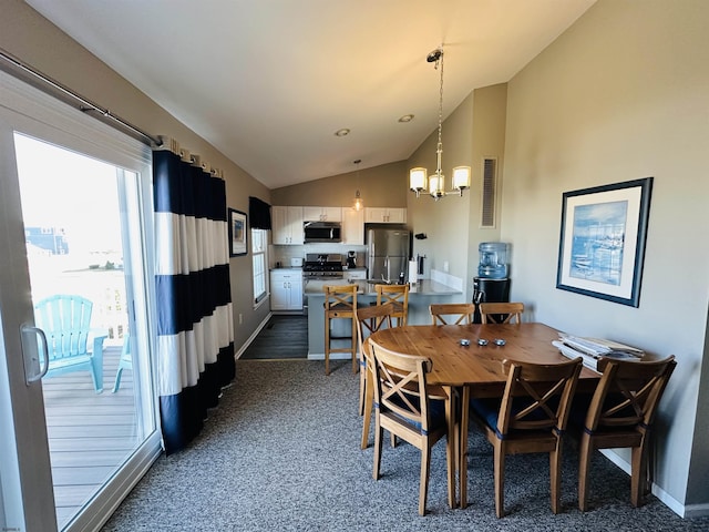 dining room with visible vents, baseboards, vaulted ceiling, dark colored carpet, and an inviting chandelier