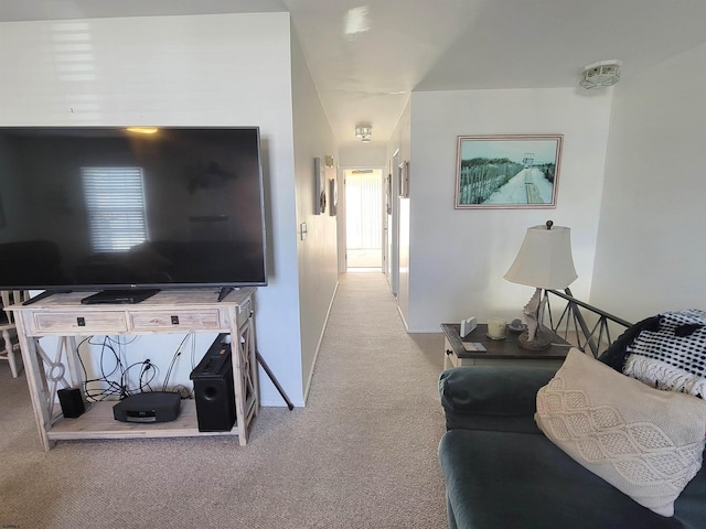 living room featuring carpet floors and baseboards