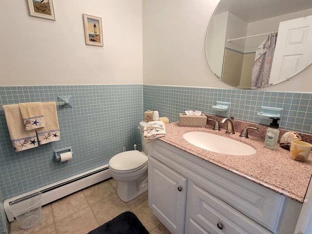 full bath with tile walls, a shower with shower curtain, toilet, baseboard heating, and vanity