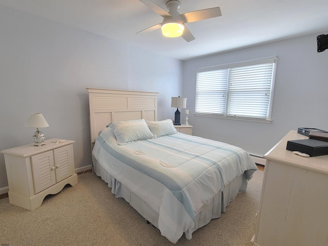 bedroom featuring ceiling fan, baseboards, baseboard heating, and light colored carpet