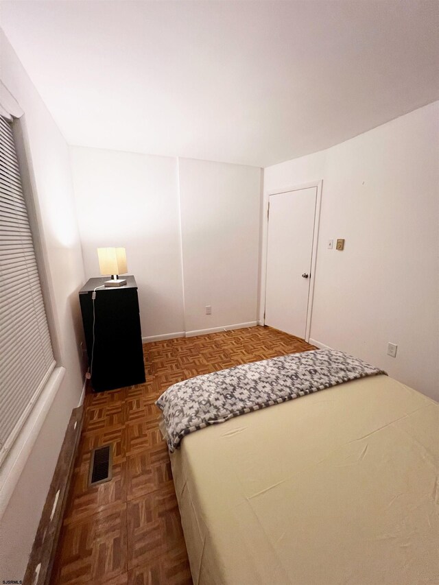 unfurnished bedroom featuring visible vents