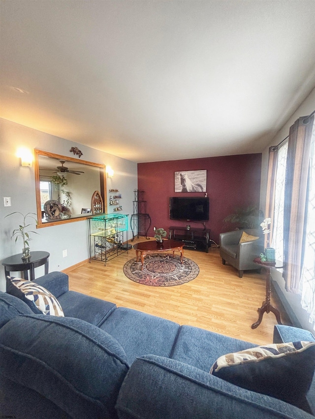 living area featuring plenty of natural light and wood finished floors