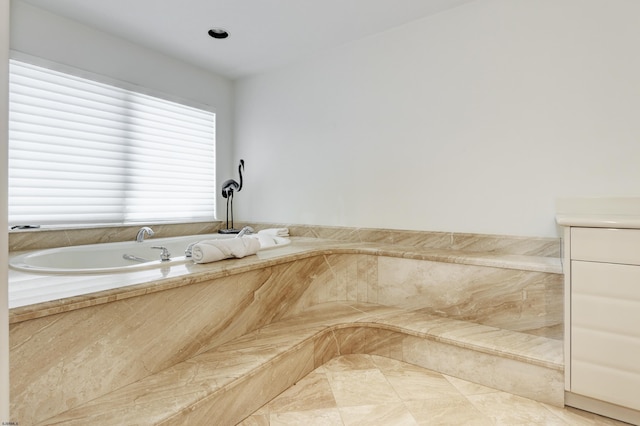 full bath with a tub with marble appearance