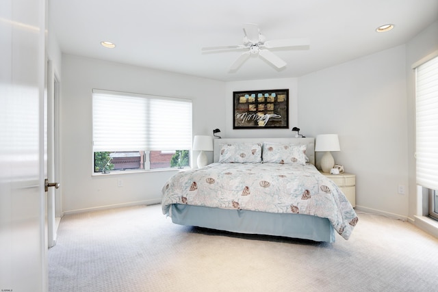 bedroom with baseboards, recessed lighting, a ceiling fan, and light colored carpet