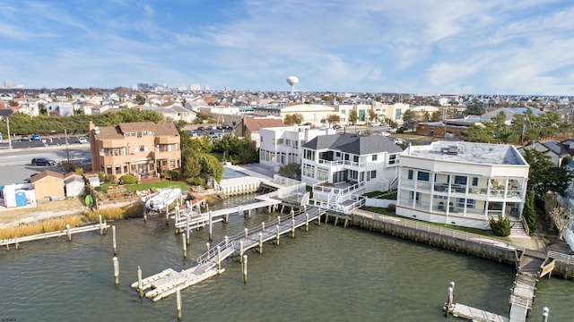 bird's eye view featuring a water view and a residential view