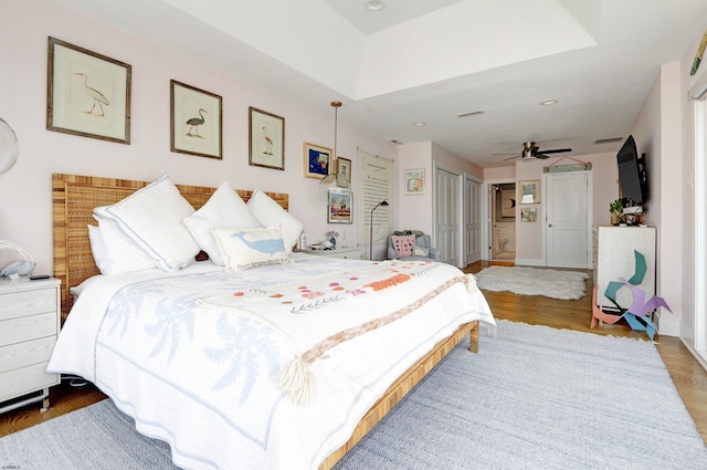 bedroom with a closet and wood finished floors