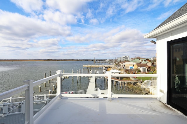 balcony featuring a water view