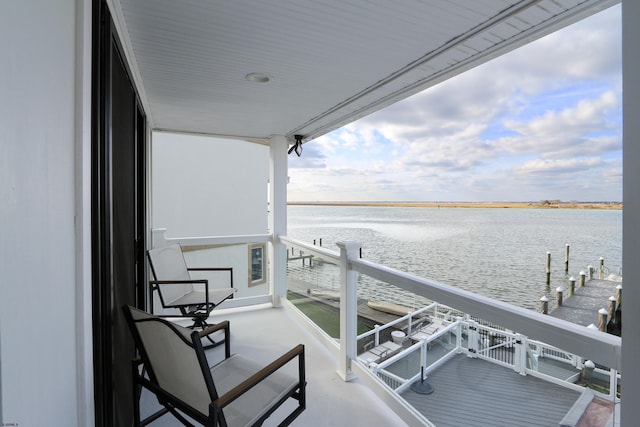 balcony featuring a water view