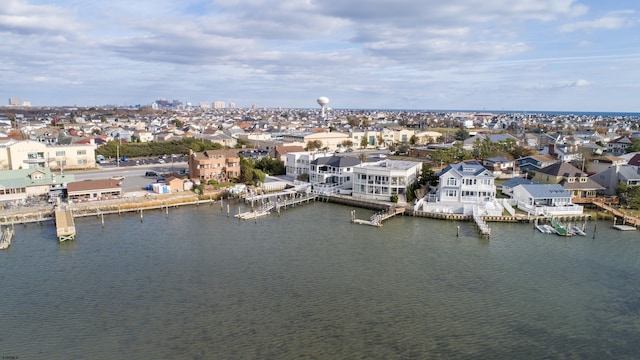 aerial view featuring a water view and a residential view