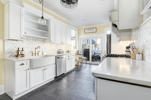 kitchen with hanging light fixtures, white cabinetry, and stainless steel dishwasher